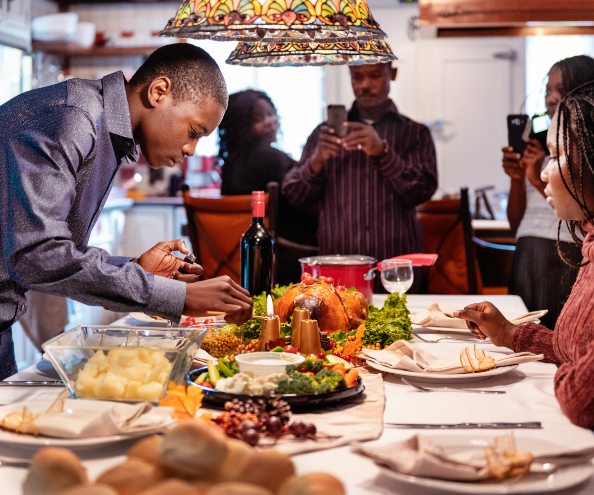 Sunset Finance - How Much To Budget For Thanksgiving Dinner -  family setting the thanksgiving dinner table