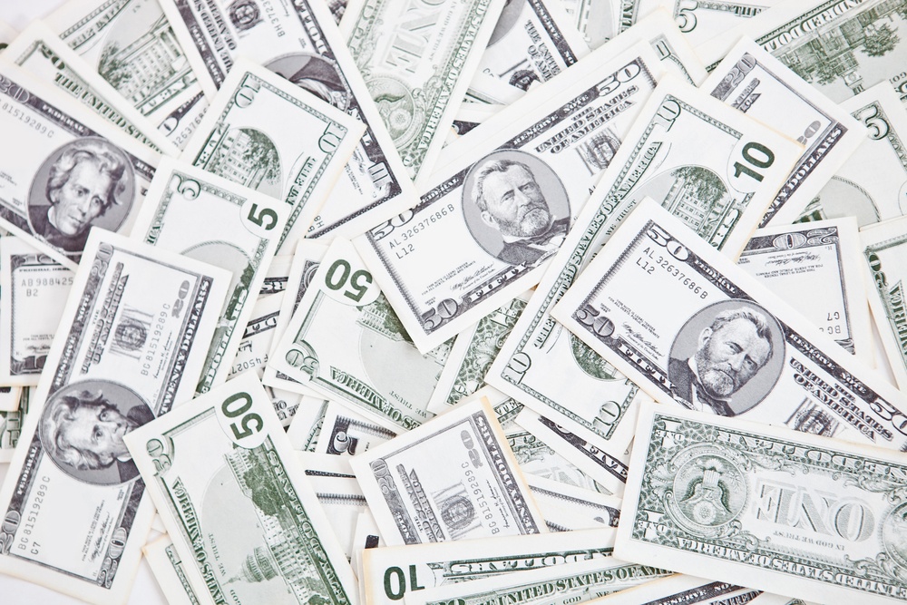 Closeup to a bunch of dollar bills - money concepts.jpeg