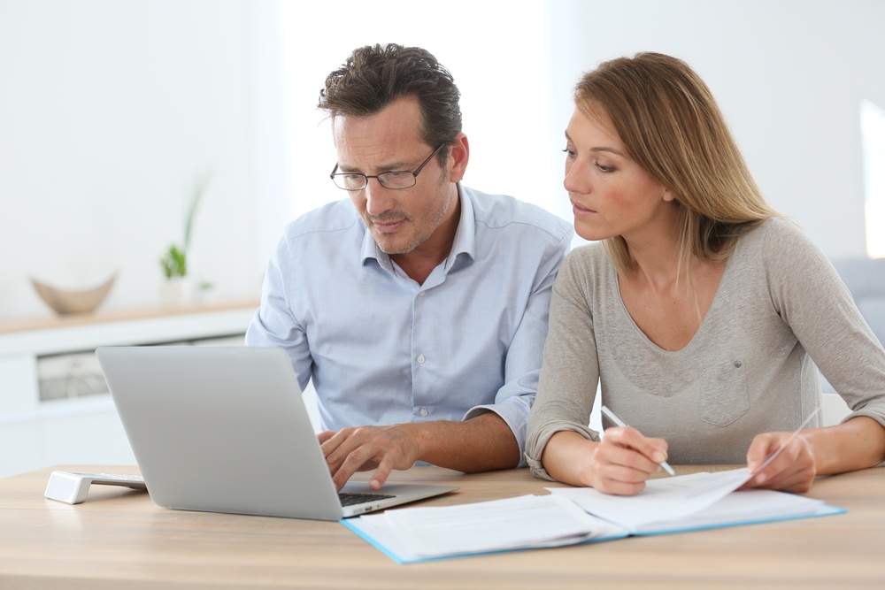 Couple at home trying to file your taxes.jpeg